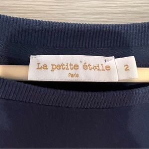 Girl’s beautiful blue sweater from Paris.